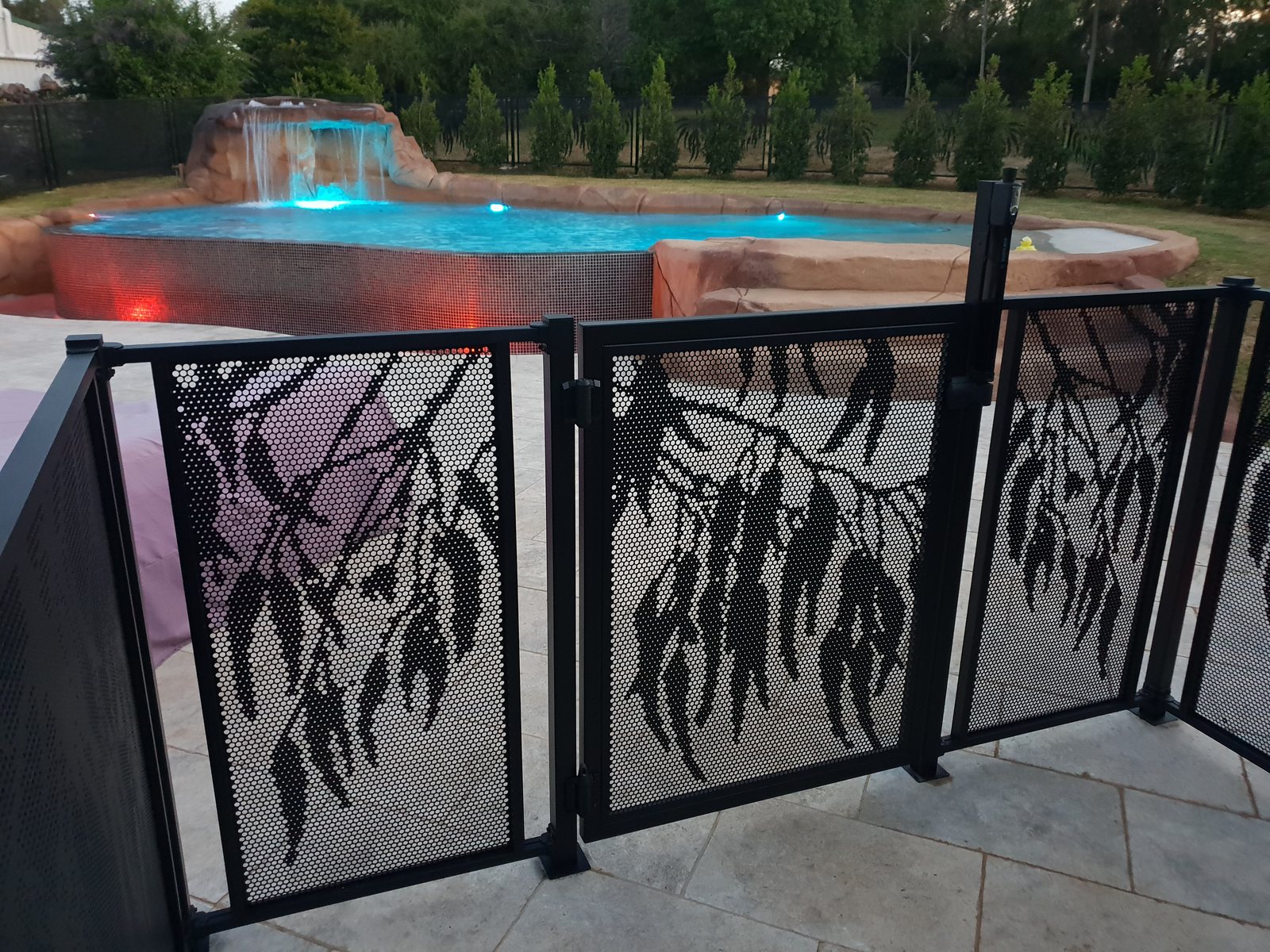 Pool Perf pool fencing installed with the Bracket Fit system, showing the shroud brackets at the posts